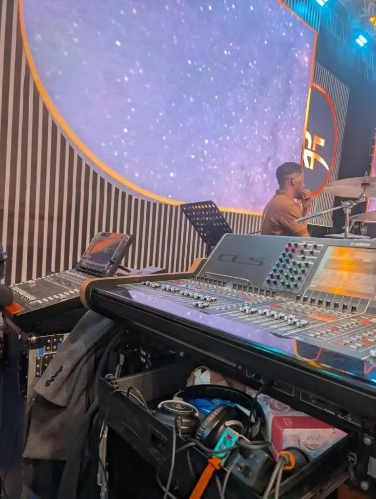 Yamaha CL5 at the stage mix position with the drummer behind it, under the starry Rhema Feast 2026 LED wall in Nairobi