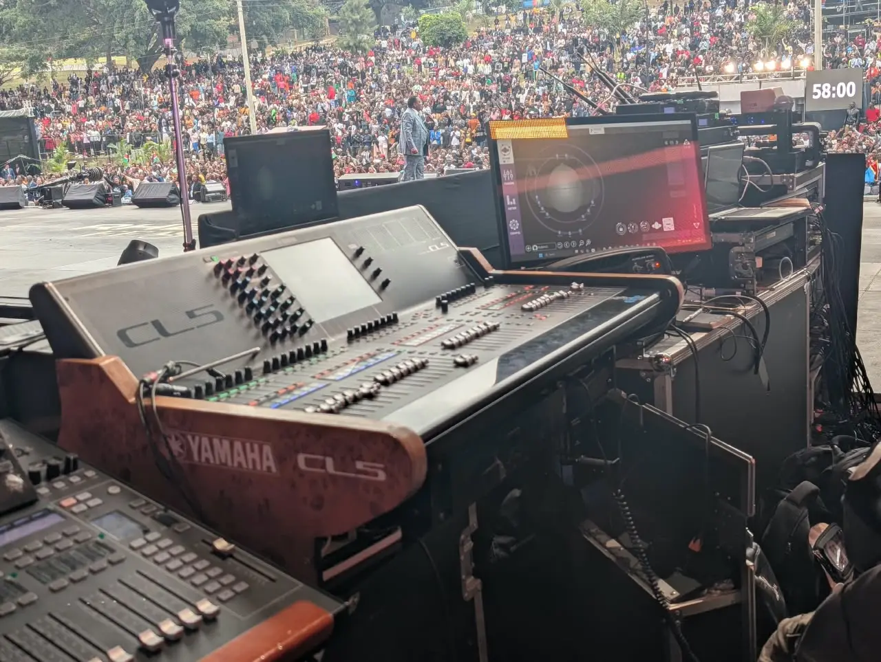 Monitor console at the stage mix position overlooking the afternoon congregation at Rhema Feast 2026, Uhuru Park Nairobi